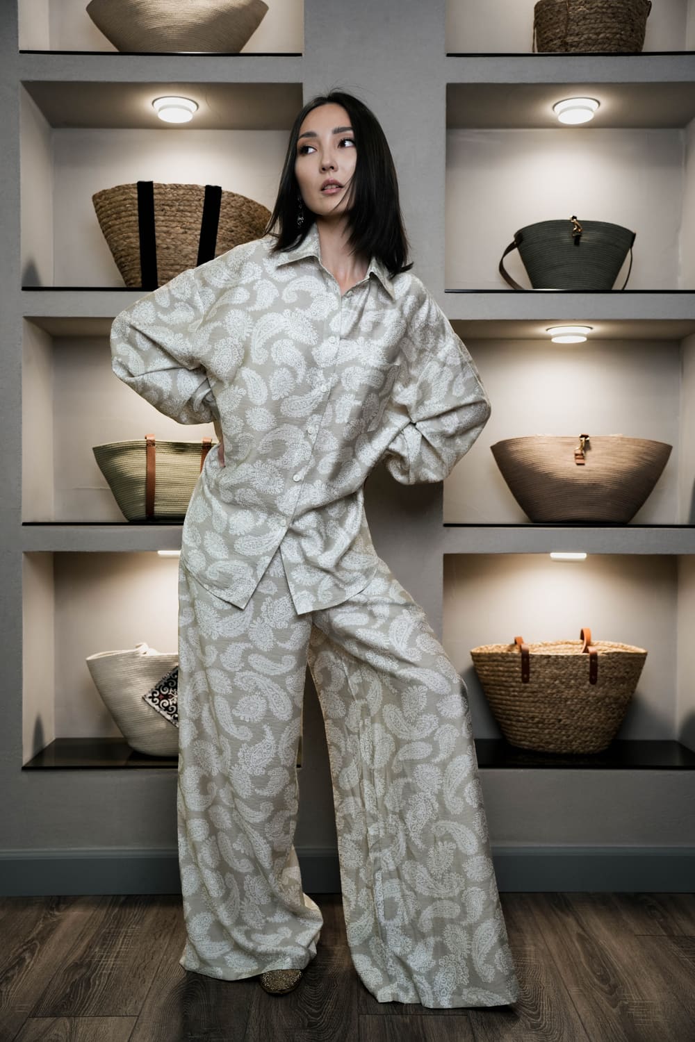 Light linen TURANAI set in the Bishkek boutique with woven bags on the shelves